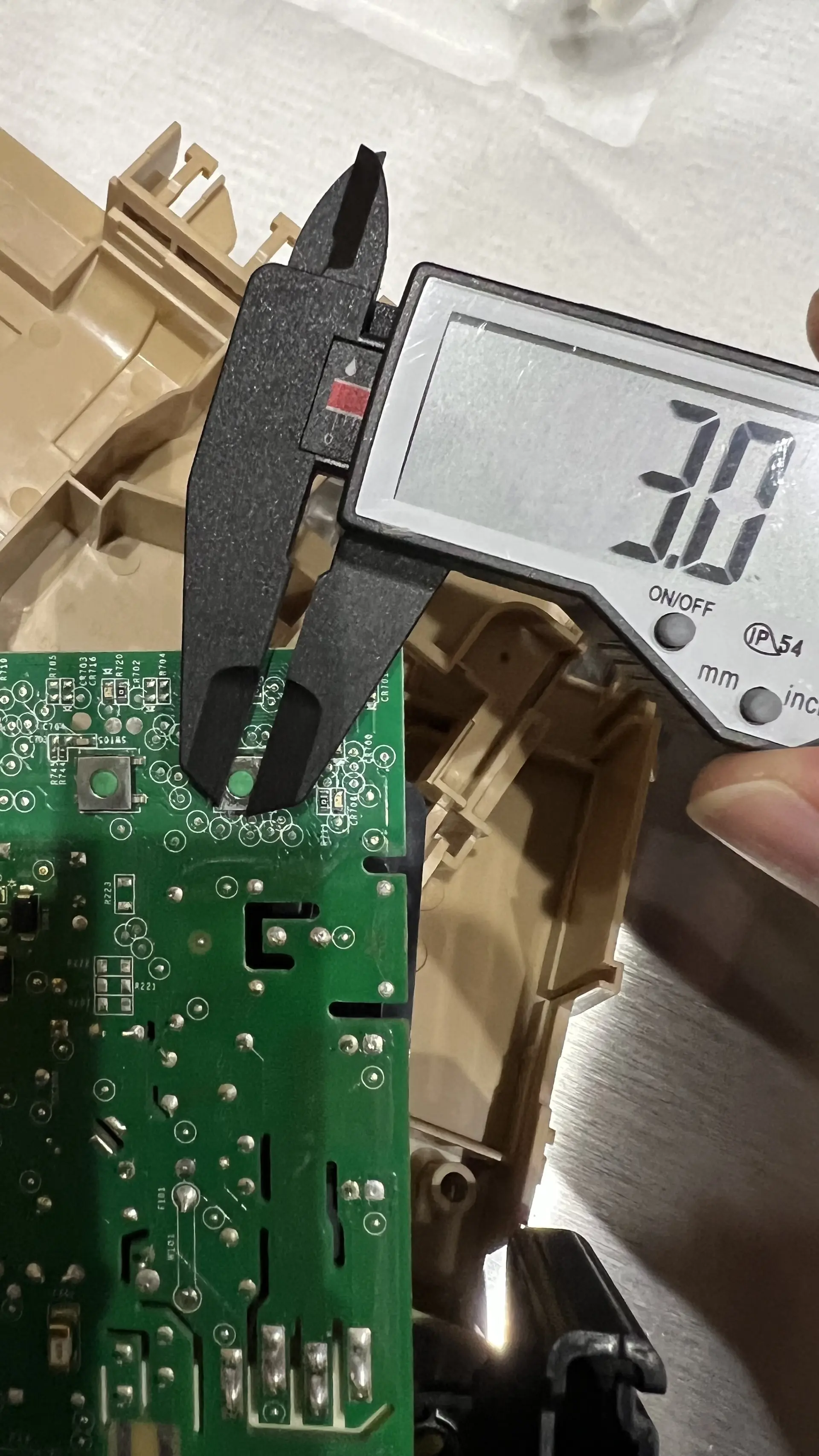 Caliper measuring switch actuator button height at 3.0mm