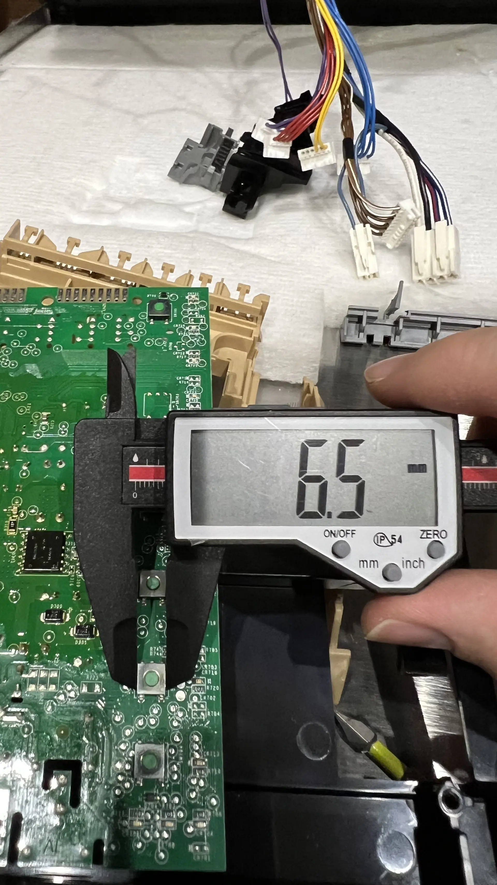 Caliper measuring switch width at 6.5mm