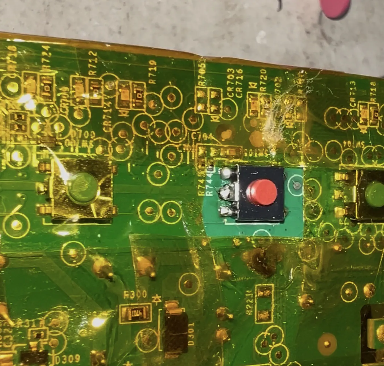 Close-up of installed replacement switch showing solder joints