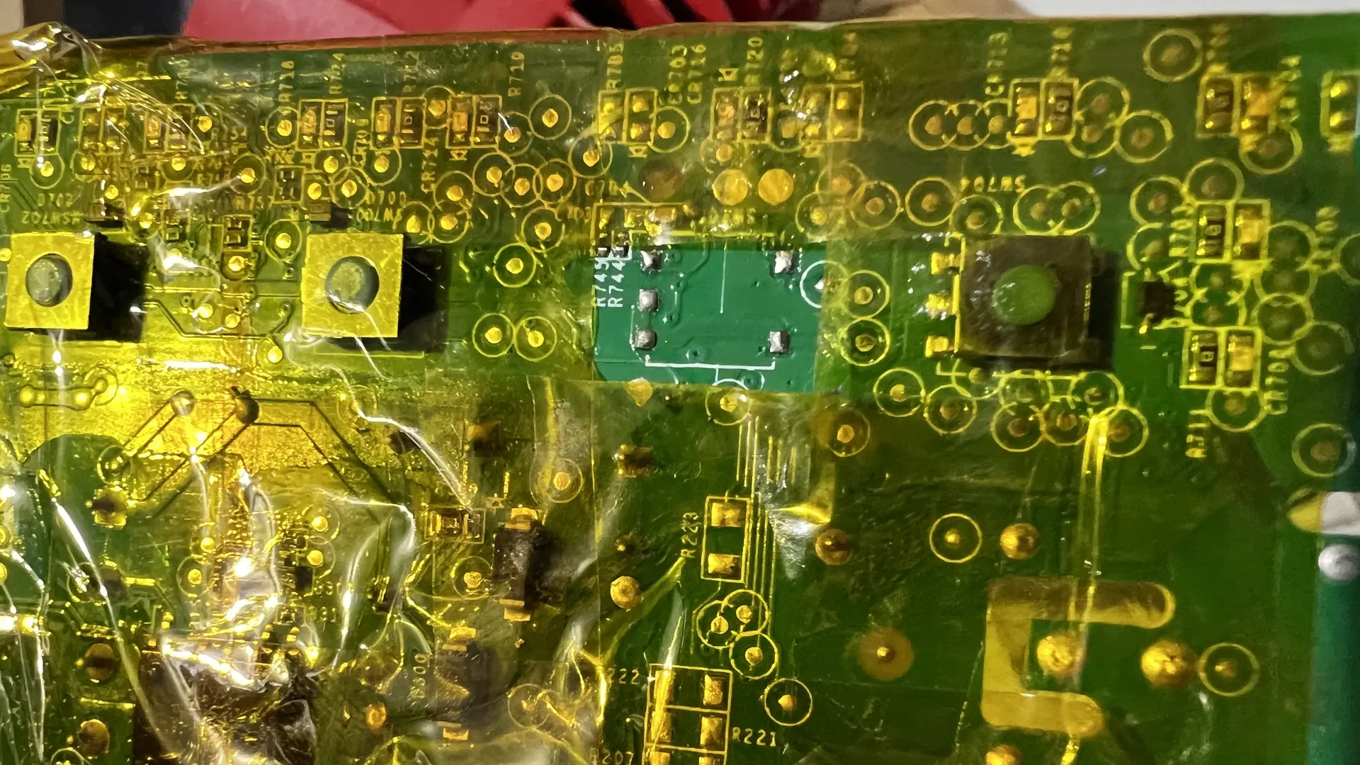 Desoldered switch area with Kapton tape protecting surrounding components